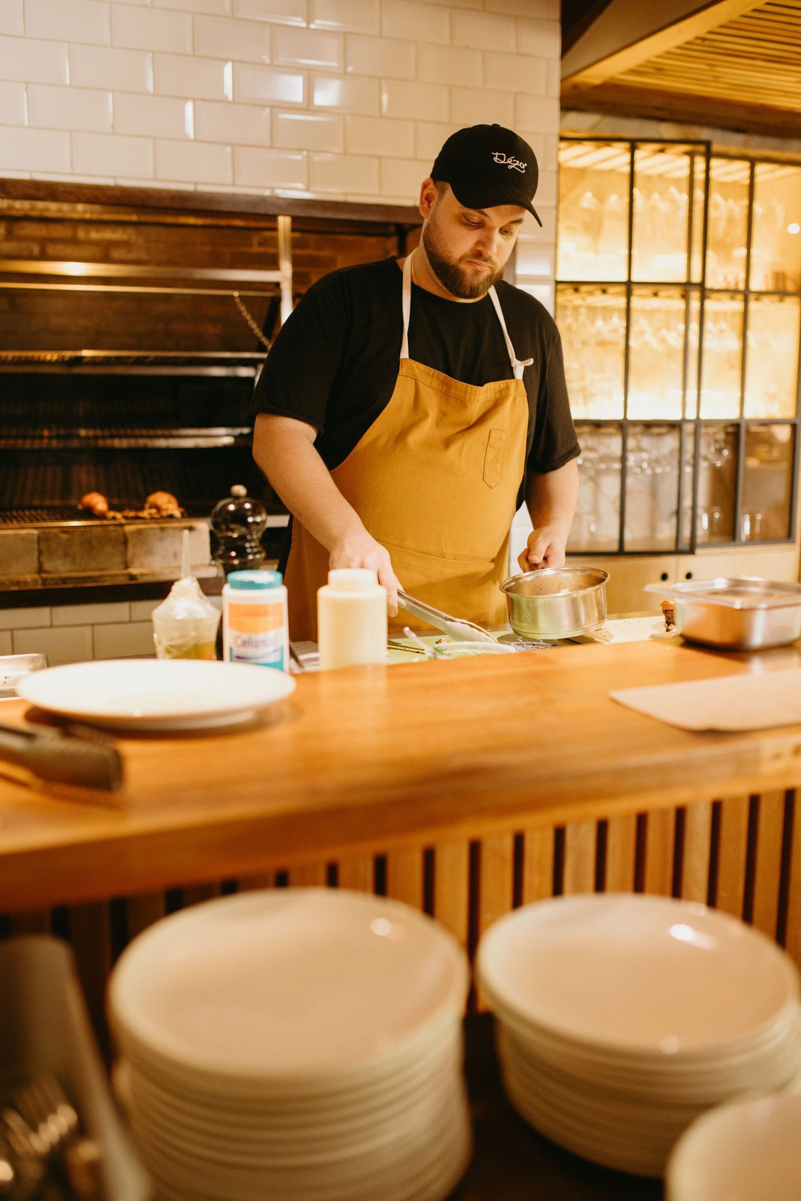 Chef preparing a dish in a restaurant kitchen